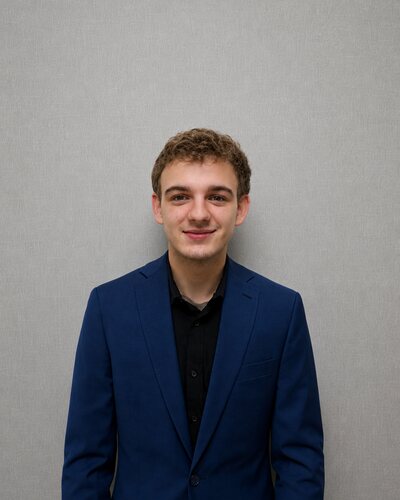 Headshot of Ayden Thayer, Marathon Momentum Group team member